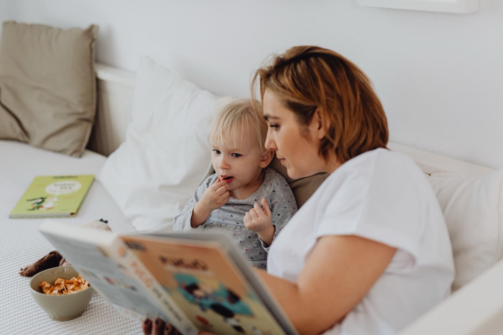 A parent and child reading together