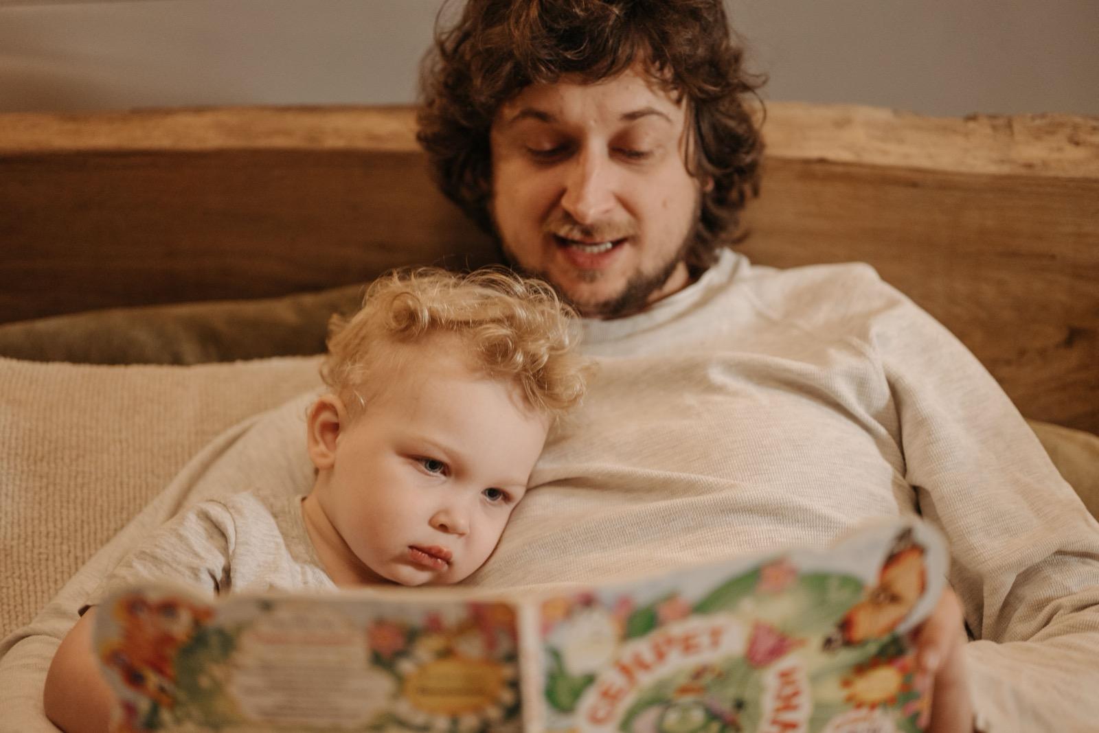 A child reading an open illustrated book